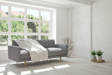 Idea of white room with sofa and summer landscape in window. Scandinavian interior design. 3D illustration