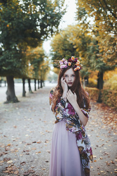 Beautiful young woman wearing flower crown