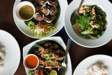 set of seafood meal served with rice and spicy sauce