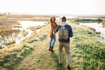 Young tourist couple at sunset sun