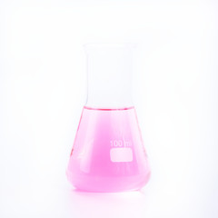 Chemical laboratory beakers with colorful liquids and reagents. 