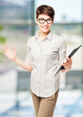 Fototapeta premium happy woman in glasses with a folder in the office rejoices