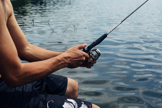 Man holding a fishing pole
