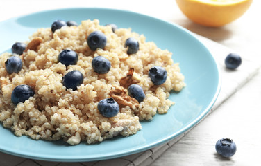 Dessert with quinoa and blueberries on table