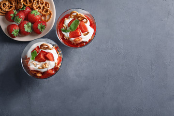 Dessert bowls with strawberry pretzel salad on table