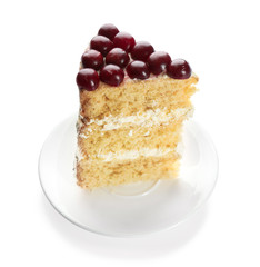 Piece of cake decorated with cherries on white background