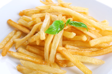 Plate with yummy french fries, closeup