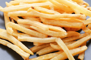 Plate with yummy french fries, closeup