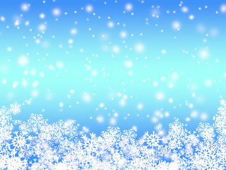 Blue light Christmas background with snowflakes 