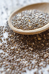 Chia seeds in a wooden spoon. Macro.