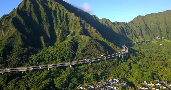 Amazing aerial footage view of the mountains by the famous Haiku stairs and stairs to Heaven hike. The living district next to the trail. Amazing Hawaii.