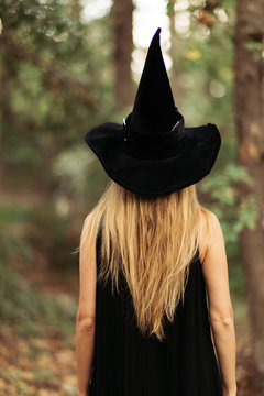 blonde girl in a witch costume