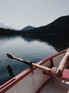 Row boat on a lake with a mountain view