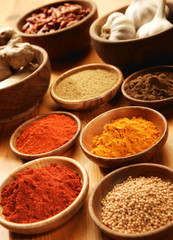 Selection of spices in wooden bowls