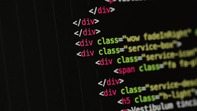 HTML and CSS code developing. Website design code programming on a laptop screen