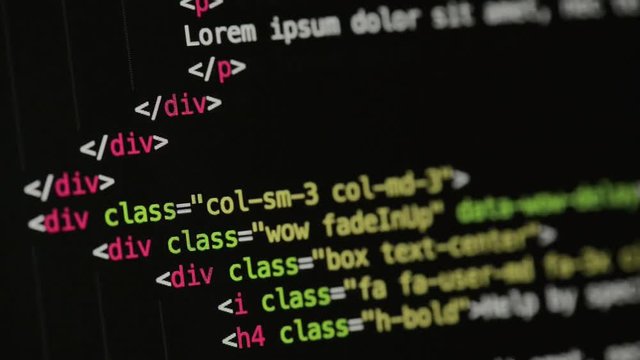 HTML and CSS code developing. Website design code programming on a laptop screen