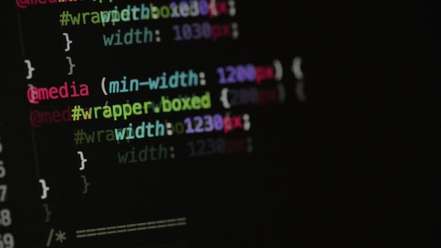 HTML and CSS code developing. Website design code programming on a laptop screen