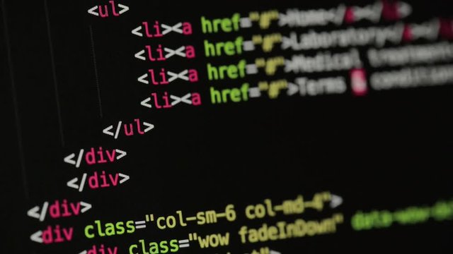 HTML and CSS code developing. Website design code programming on a laptop screen