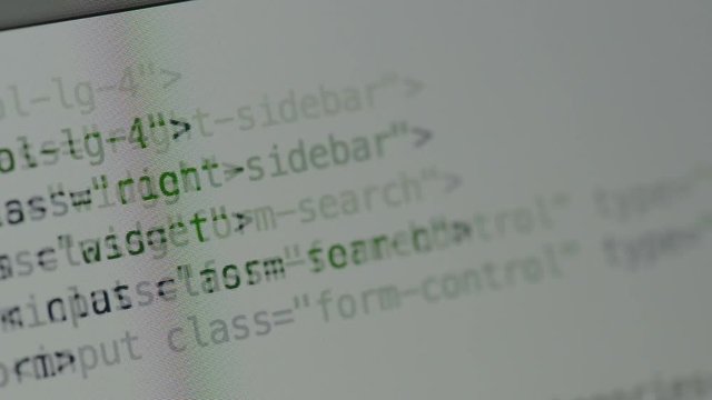 HTML and CSS code developing. Website design code programming on a laptop screen