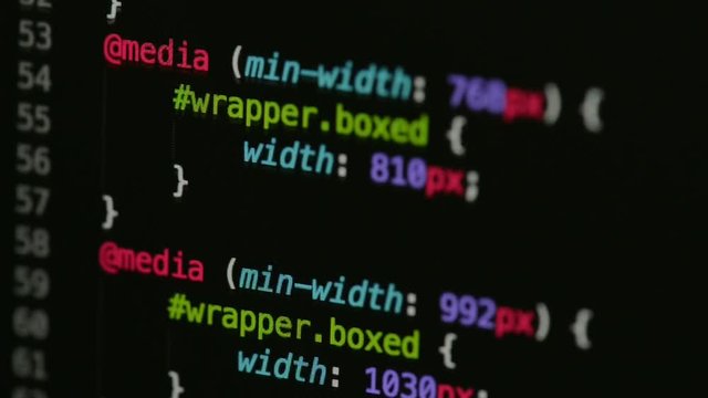 HTML and CSS code developing. Website design code programming on a laptop screen
