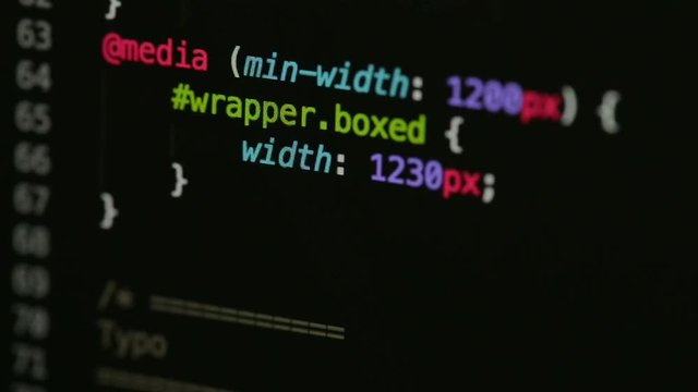 HTML and CSS code developing. Website design code programming on a laptop screen