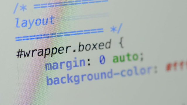 HTML and CSS code developing. Website design code programming on a laptop screen