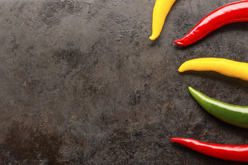 cayenne chilli peppers on rusty metal background