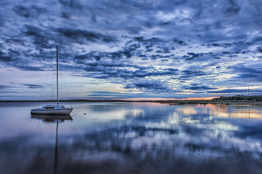 Travel Concepts. Amazing Picturesque Braslav Lakes in Belarus. With Small Sailing Boat on The Background. Taken During Blue Hour.