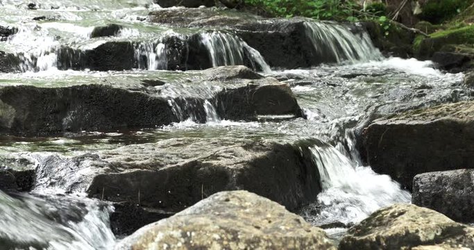 Stream flows over stones in Acadia National Park