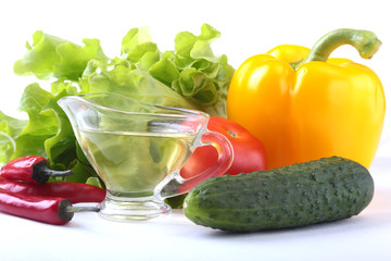 Assorted vegetables, fresh bell pepper, tomato, chilli pepper, cucumber, olive oil and lettuce isolated on white background. Selective focus.