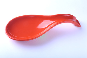 red portionen plate. isolated on white. selective focus close-up shot.