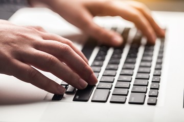 Woman working on laptop.