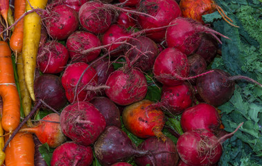 Organic beets and vegetables for sale at farmers market.