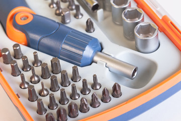 Manual, home tool. Set heads under the nut. Metal bits and flat-head screwdriver. Nozzles and...