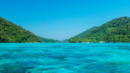 Fototapeta na wymiar Blue and bright sea water surface at the open sea, Beautiful blue sea at Surin island, Thailand