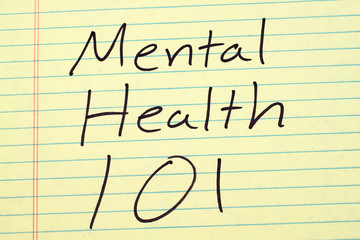 The words "Mental Health 101" on a yellow legal pad