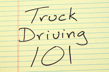The words "Truck Driving 101" on a yellow legal pad