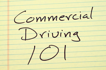 The words "Commercial Driving 101" on a yellow legal pad