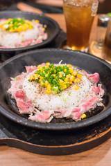 pork with rice on hot pan