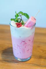 strawberry popsicle with pink milk in glass