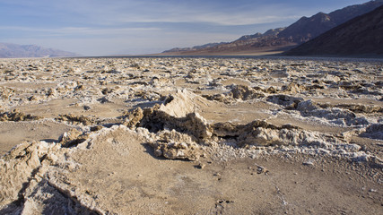 The sun baked floor of Badwater Basin in Death Valley National Park at dawn.  The lowest point in North America at 282 feet below sea level.  