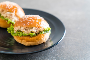 tuna burger on black plate