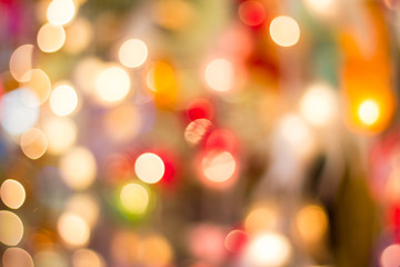 Blurred- bokeh Decorative outdoor string lights hanging on tree in the garden at night time - decorative Christmas lights - happy new year 