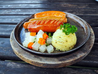 fried sausages in pan