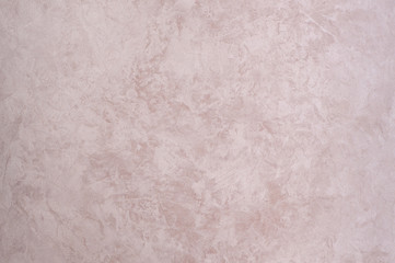 background of the plastered texture with marble effect pink colour. artistic background handmade