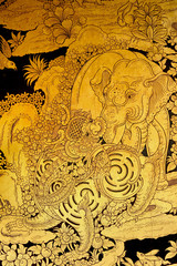 Fototapeta na wymiar lion and elephant Scene Painted on a Temple Windows