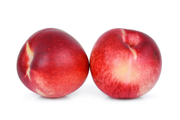 two whole of nectarine fruit isolated on whitie background