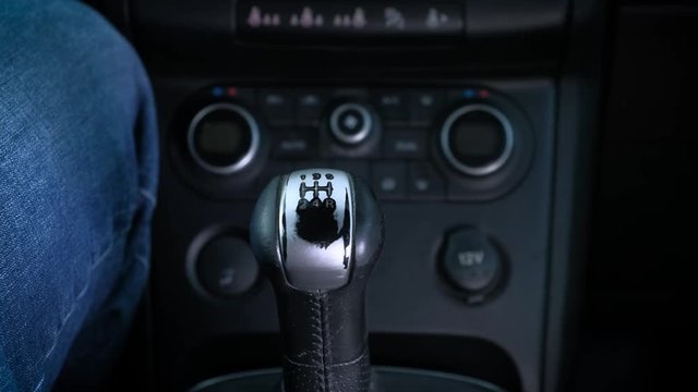 Manual Transmission. The man switches gears. Quickly rides
