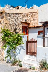Fototapeta na wymiar Street with steps in Sitia town, Crete island, Greece