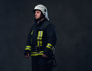 Fototapeta premium Studio portrait of firefighter dressed in uniform.